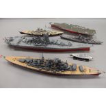 A collection of military model war ships and aircraft carriers.