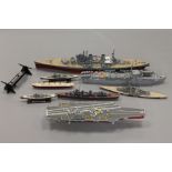 A collection of military model war ships and aircraft carriers.