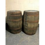 Two large old coopered wooden barrels stencilled Laphroaig Malt whisky,