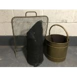 An antique brass coal bucket with liner together with one other coal bucket and a brass spark guard