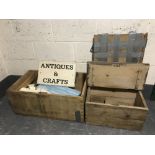 Two stripped pine boxes containing an antique centre sign and pieces of wood