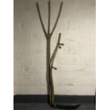 An early 20th century rustic hay fork together with a scythe