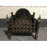 An early 20th century cast iron fire grate