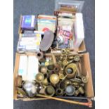 Two boxes containing 45's, brass ware, cased binoculars, audio books,