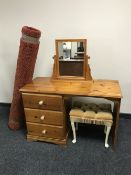 A three drawer pine pedestal dressing table with mirror,