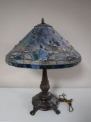 A Tiffany style table lamp with dragon fly leaded shade