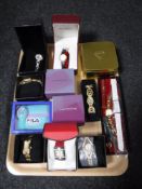 A tray containing assorted boxed lady's wristwatches including Citizen etc