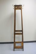 An Edwardian oak hat and coat stand