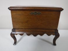 A Georgian style miniature chest on stand