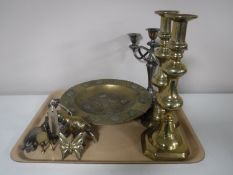 A tray of candlesticks, brass ashtray bowl with coin decoration, brass figures, plated servers,
