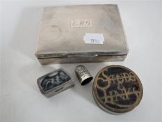 A sterling silver cigarette box together with a continental silver pill box,