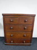 A Victorian pine five drawer chest