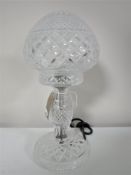 A cut glass table lamp with shade,