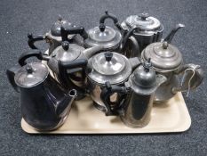 A tray of eight plated teapots
