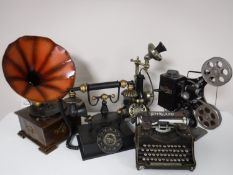 Five contemporary metal ornaments including Keystone projector, Govrland typewriter, telephone,