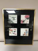 A gilt frame containing four Chinese watercolours