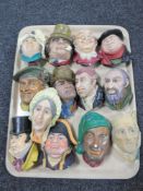 A tray of thirteen Bossons wall plaques - Dickens characters etc