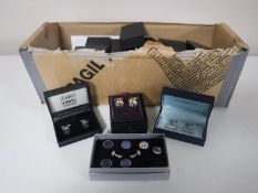 A collection of boxed cuff links and tie pins