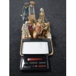 A tray of four Country Artists Views of Life figures together with two boxed Norman Rockwell from