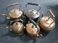 Five antique copper kettles