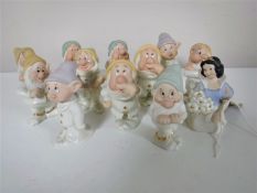 Snow White and the Seven Dwarves salt and pepper pots together with a display stand