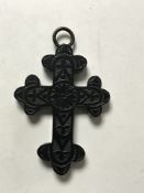 A Whitby Jet crucifix pendant, length 6.5 cm.