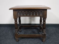A classical style oak coffin stool