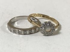 A white gold diamond half eternity ring and an 18ct gold diamond and opal cluster ring
