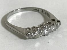 A five stone diamond ring set in 18ct white gold and platinum