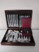 A mahogany cased set of Sheffield stainless steel cutlery together with a wine kit