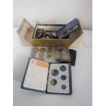 A box containing pre-decimal British coinage, Britain's first decimal coin sets,