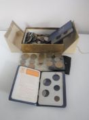 A box containing pre-decimal British coinage, Britain's first decimal coin sets,