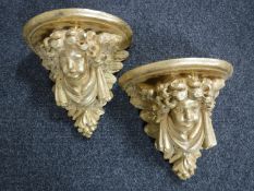 A pair of carved classical style corbels depicting cherubs CONDITION REPORT: One