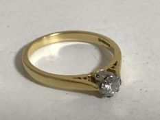 An 18ct gold diamond solitaire ring, approximately 0.25ct, size M.