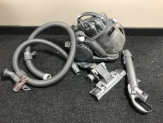 A Dyson DC8 vacuum with accessories