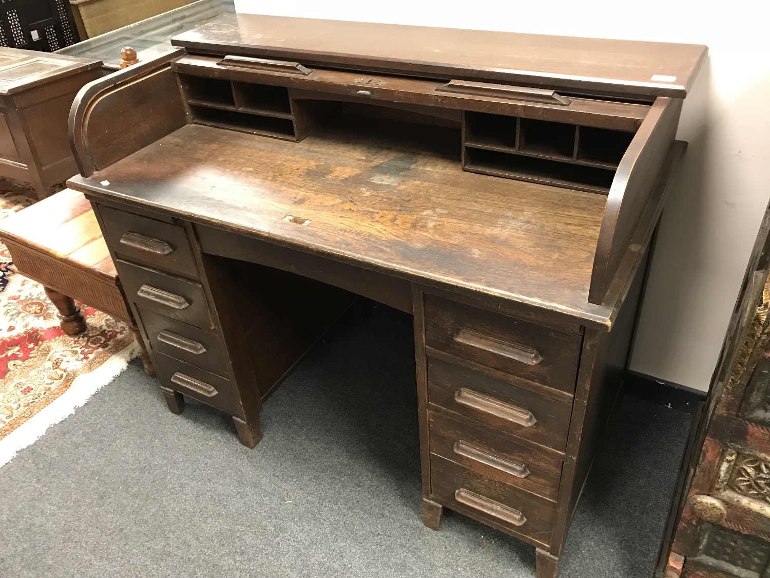 A 1920's oak roll top desk,