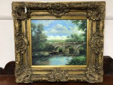 An oil on canvas - figures on a bridge, in an ornate gilt frame, 60 cm x 49 cm .