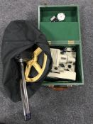 A trundle wheel in bag and a cased Umig vintage projector
