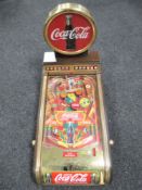 A table top Coca Cola battery operated pinball machine CONDITION REPORT: There are