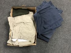 Two boxes of military trousers