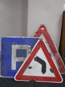 Three metal road signs