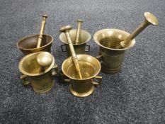 Five brass pestle and mortars