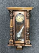 A mahogany cased eight day wall clock with enamelled dial