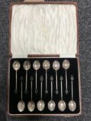 A set of twelve cased Art Deco silver coffee spoons