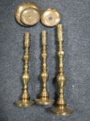Three brass candle holders