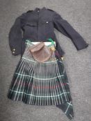 A box of military tunic and kilt, leather sporran pouch, leather cow boy hat,