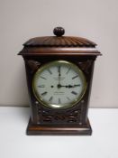 A mid-19th century rosewood and mother of pearl inlaid striking bracket clock,