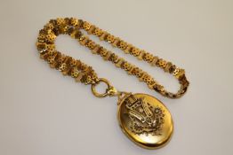 A diamond and seed pearl set yellow metal locket,