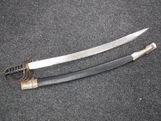 An Indian sword in scabbard with etched blade