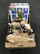 A box containing Melissa & Doug Christmas figurines, soft toys,